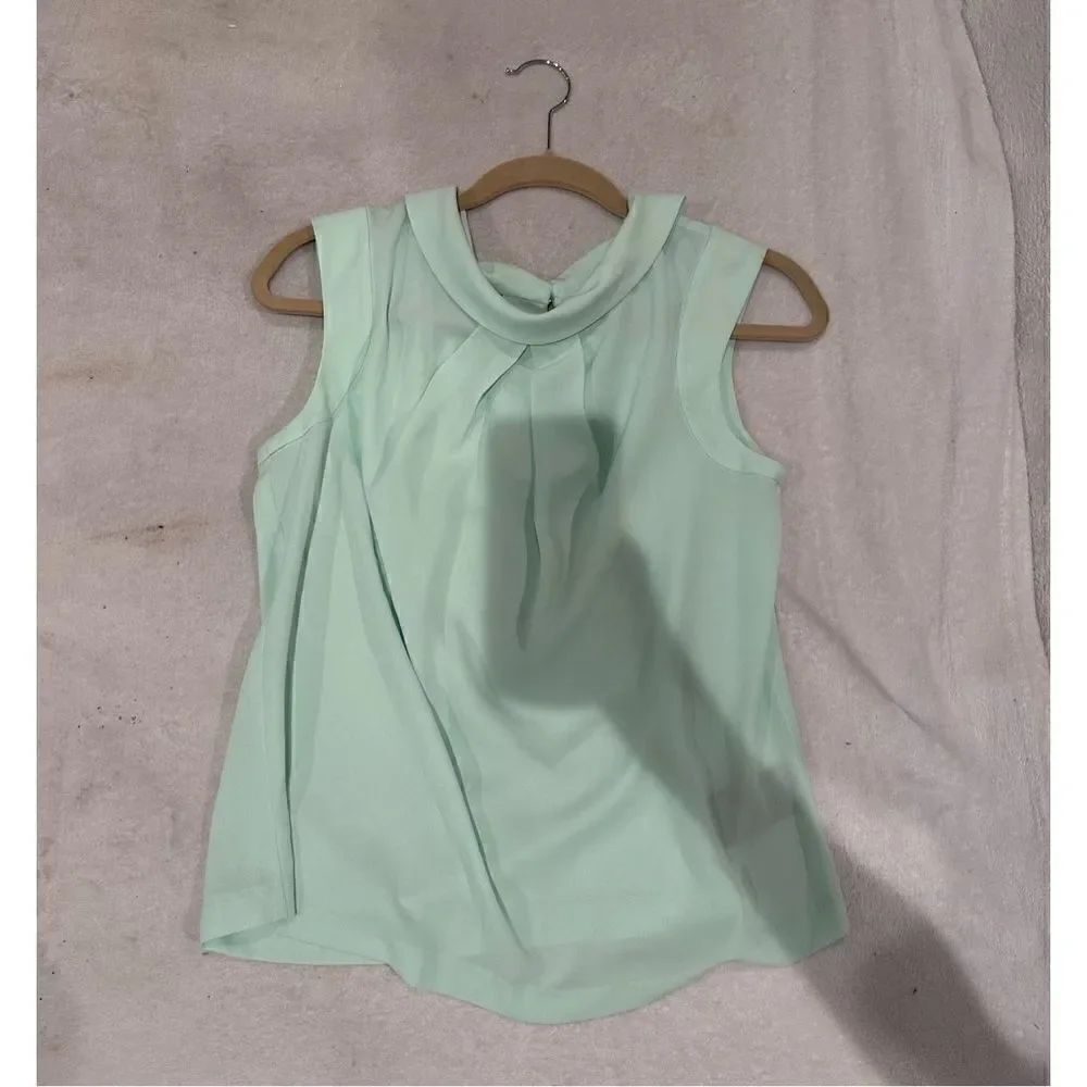 Bebe women’s mint green blouse size M